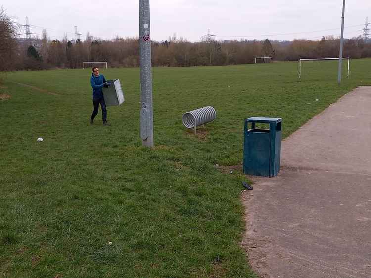 Patrick righting an errant bin on Saltworks Playing Fields. Image: Frodsham Ward Lib Dems