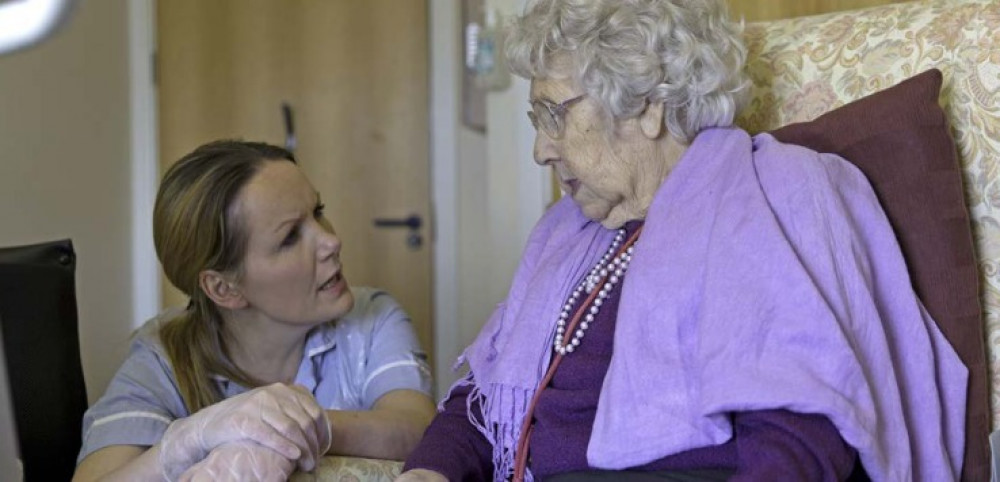 An Elderly Somerset Resident Receiving Care From A Nurse. CREDIT: Healthwatch Somerset. 