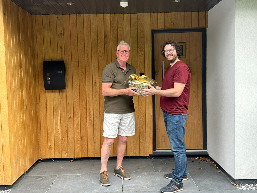 Daniel Matthias presenting luxury hamper to Phil Hulme. (Photo: Daniel Matthias)