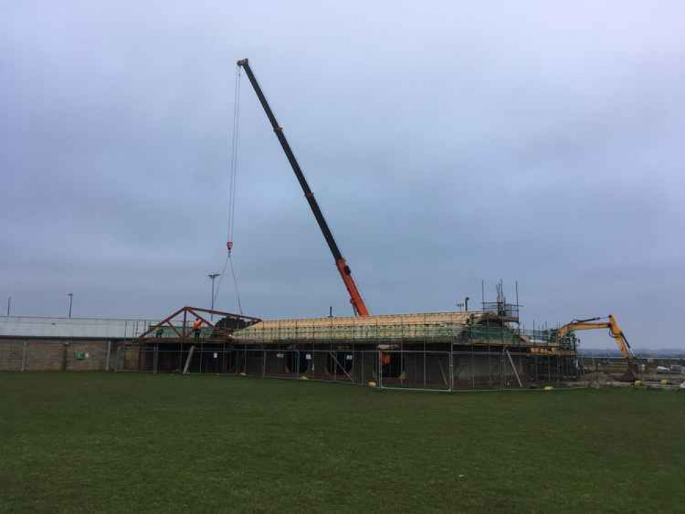 Ridge beam being lowered into position