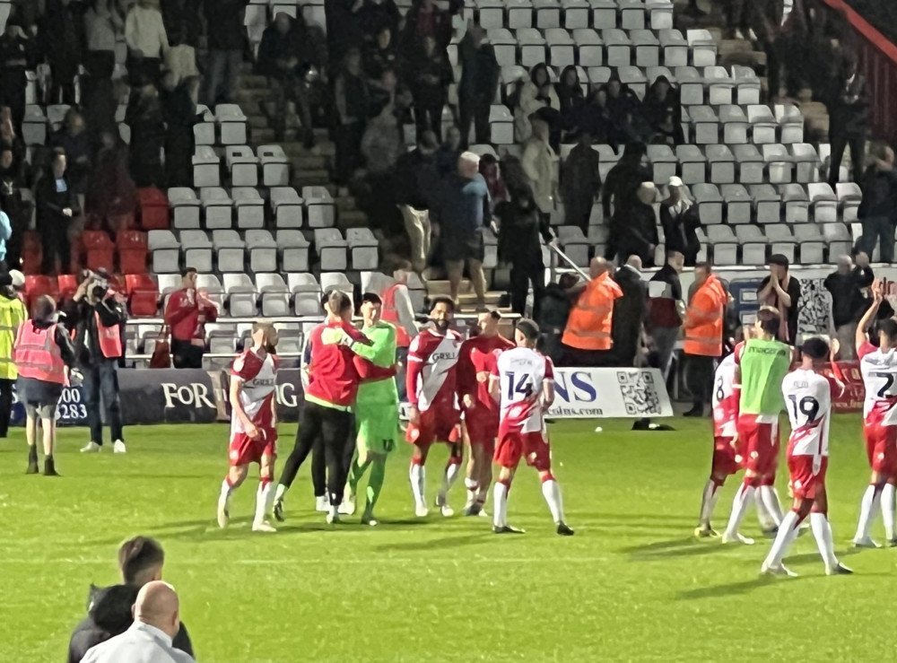 Stevenage players celebrate after beating Championship side Watford at the Lamex on Tuesday evening. CREDIT: @laythy29 