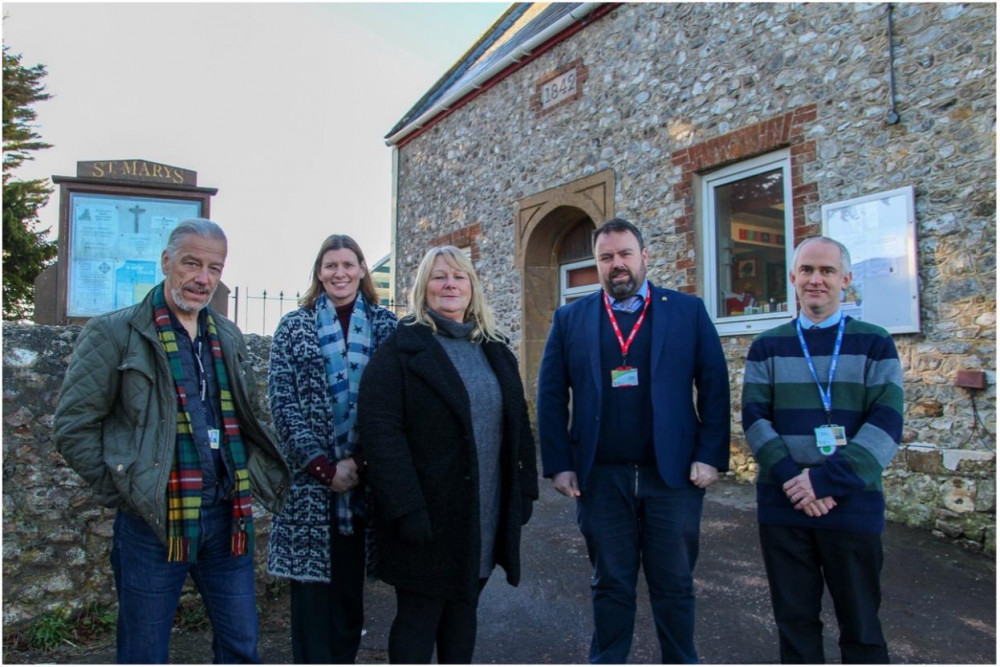 West Dorset MP Chris oder (second from right) pictured with staff from Marshwood CofE Primary Academy earlier this year