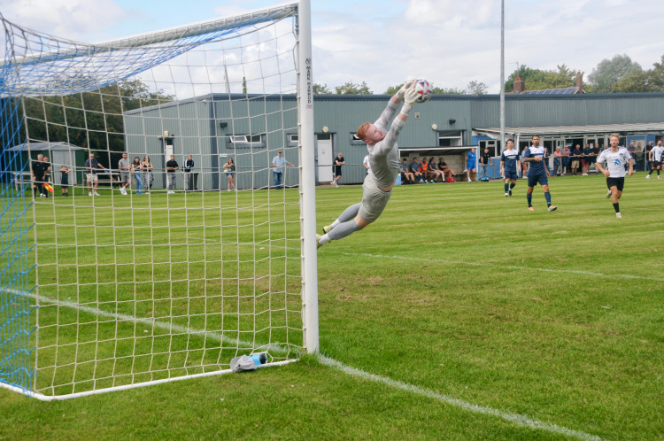 Hadleigh keeper Jack Spurling saves this one (Picture: Nub News)