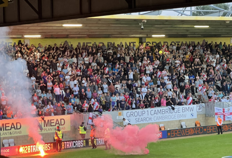 Stevenage fans celebrate Jordan Roberts 27th minute goal at the Abbey Stadium. CREDIT: @laythy29 