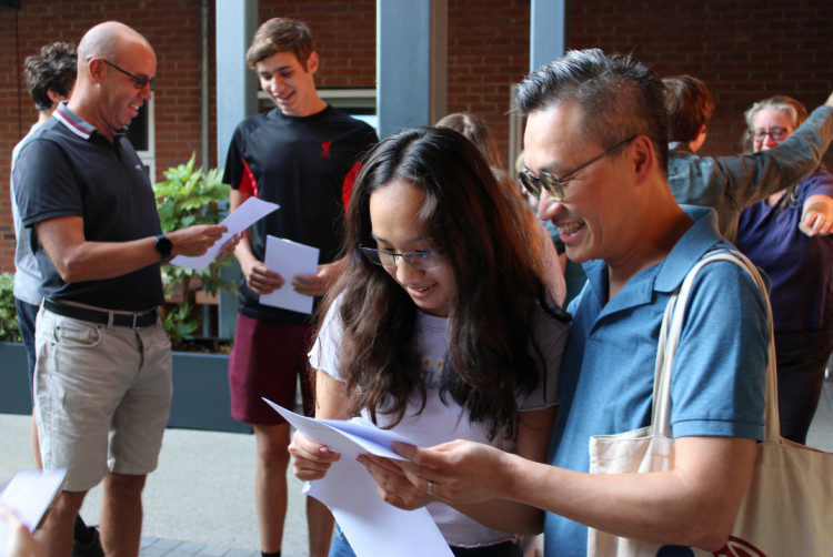 Students opening A-level exam results. (Photo Kingston: Grammar School)