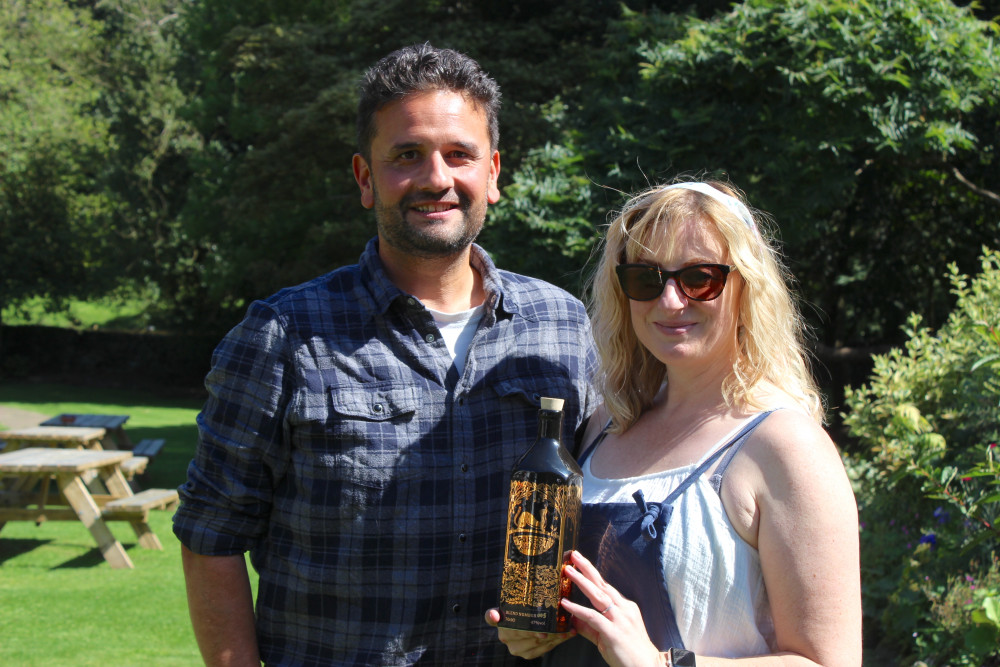 Macclesfield residents and distillers Karl and Lindsay Bond with a bottle of Forest Whisky. (Image - Macclesfield Nub News) 