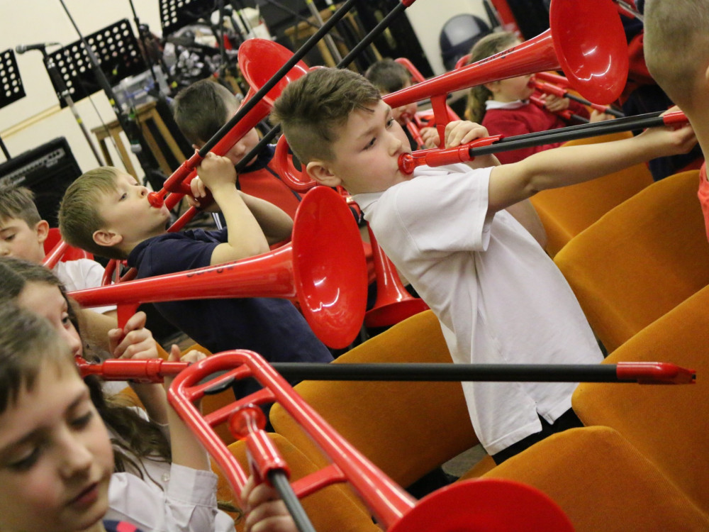 Plastic instruments were used which help deaf children feel the vibrations. (Photo: Foden's Band)