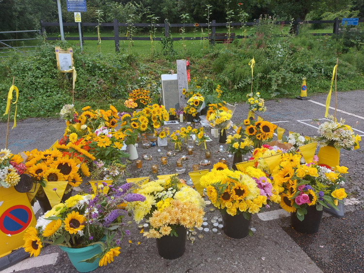 The car park in Radstock with flowers marking the tragic murder of Charley Bates