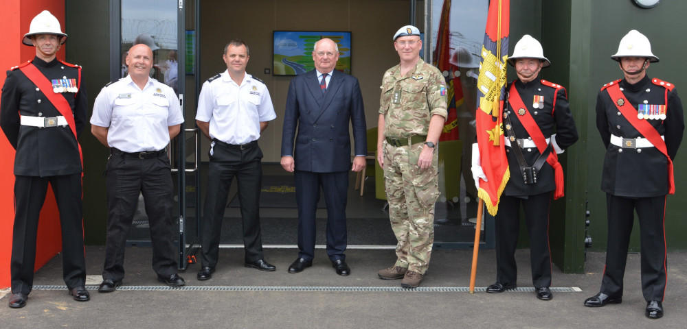 Group Manager Conrad Burgess, left, operational training centre manager, Chief Fire Officer Jon Lacey,  Cllr Andrew Reid, and Colonel Toby Moore MBE, accompanied by the SFRS Standard Party at the opening of the new training centre. (Picture: SFRS)