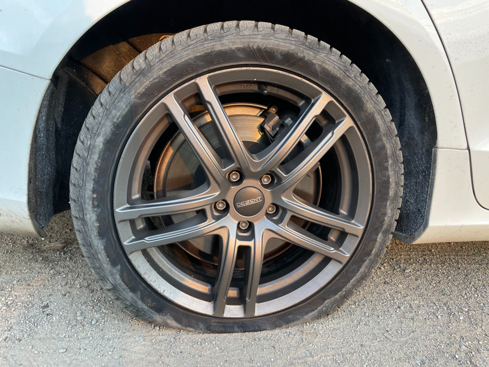 Climate activists have attached a flyer to cars that have had their tyres deflated. (Image: Supplied)