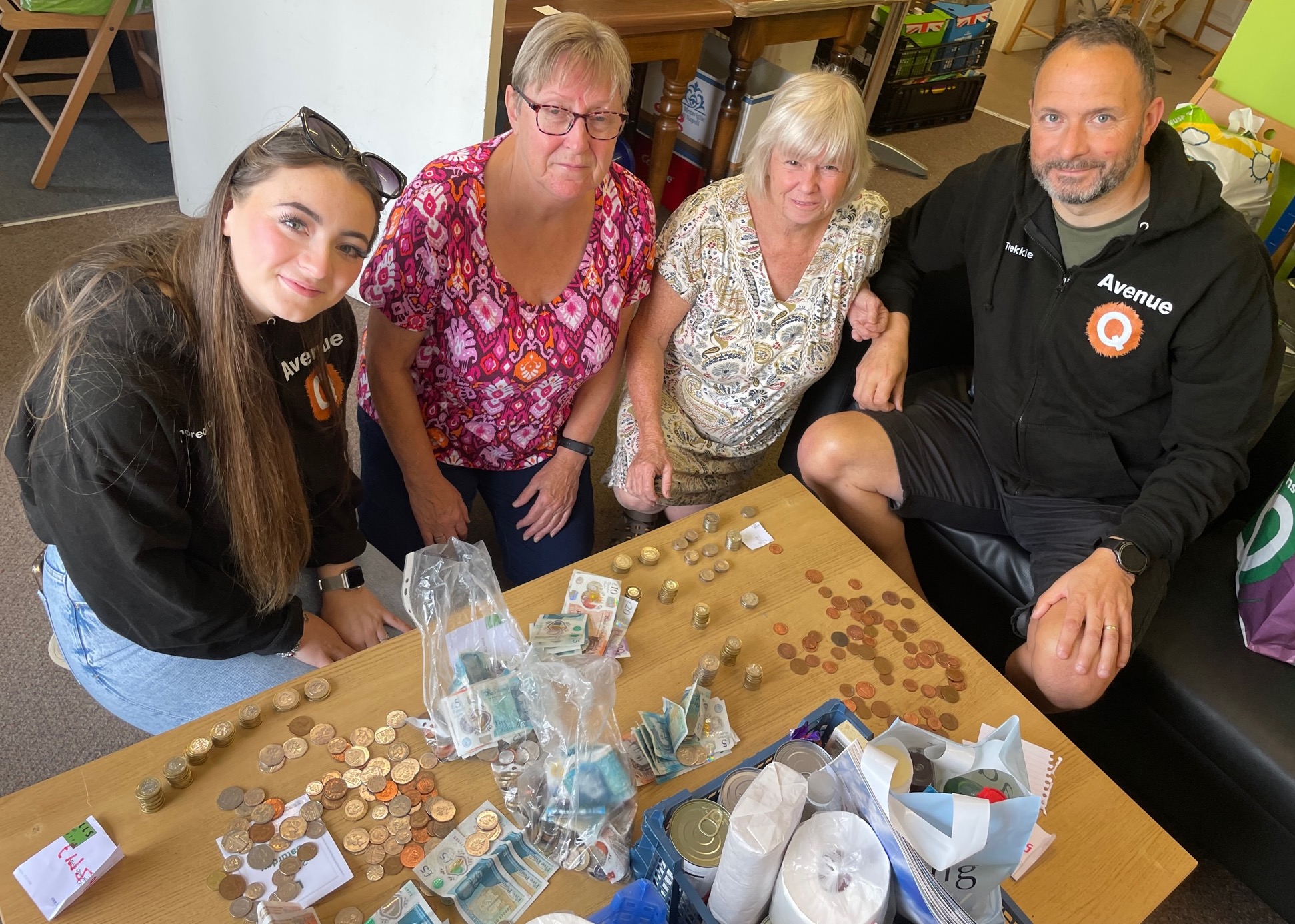 Counting the cash: Elisha and Glynn Webster with the Food Bank’s Sue Hubbard and Sue Marland 