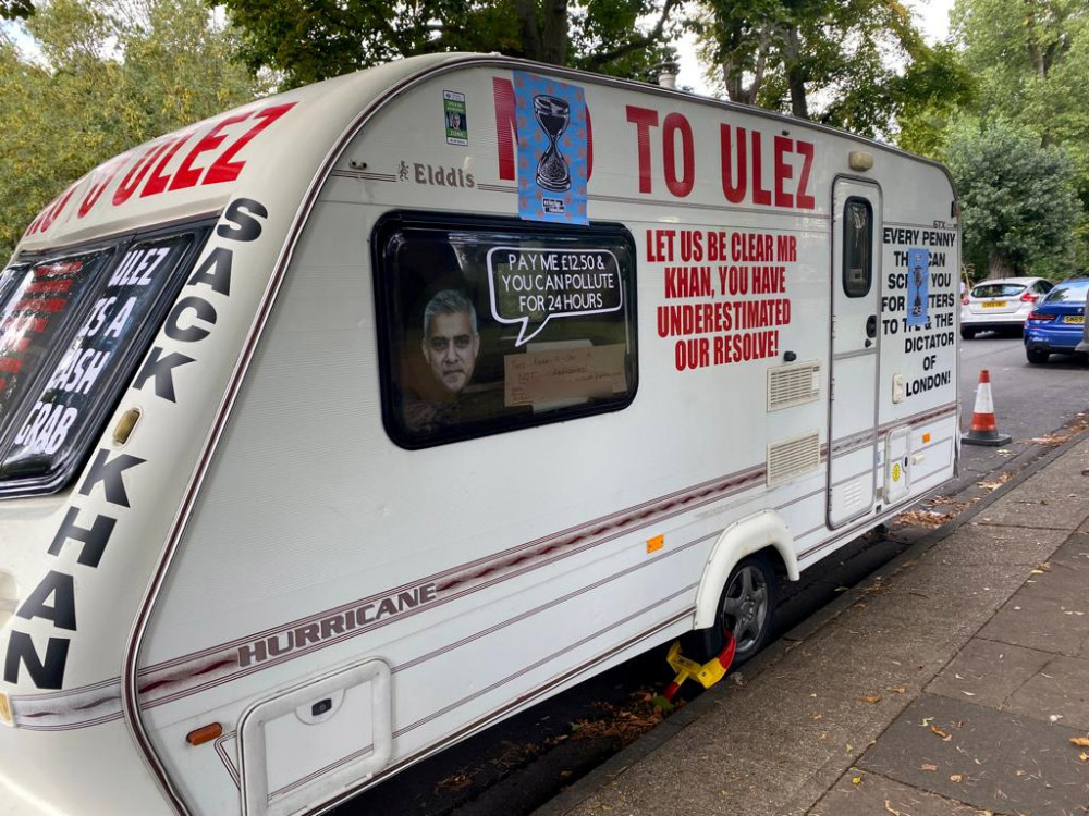 Caravan with ULEZ protest slogans chained outside the Mayor of London's house. (Photo: Jon Mills)