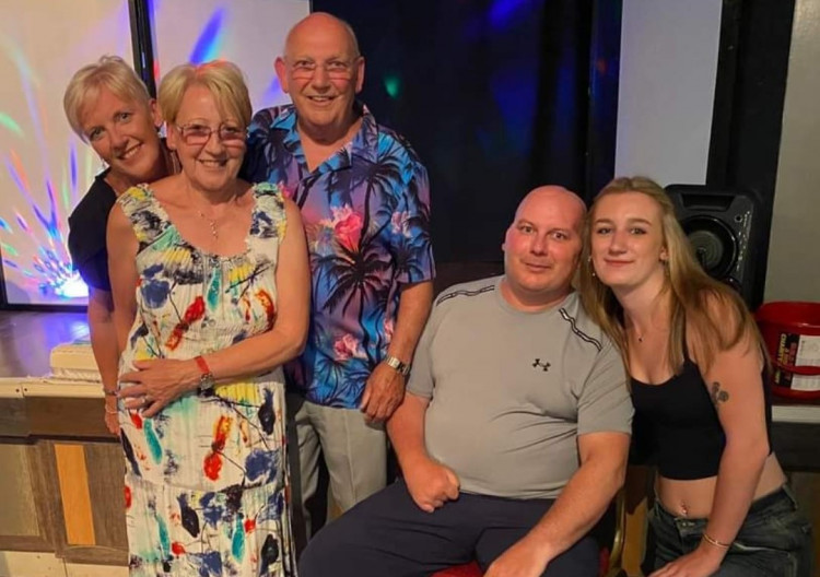 Gary Crutchley (second from right) suffered a stroke in 2020 which completely altered his life. His family are raising money to help him in the next stage of his life (Left to right: Gary's sister Serene, their mum and dad, Gary, and his daughter Ellie) (Image - Serene Crutchley)