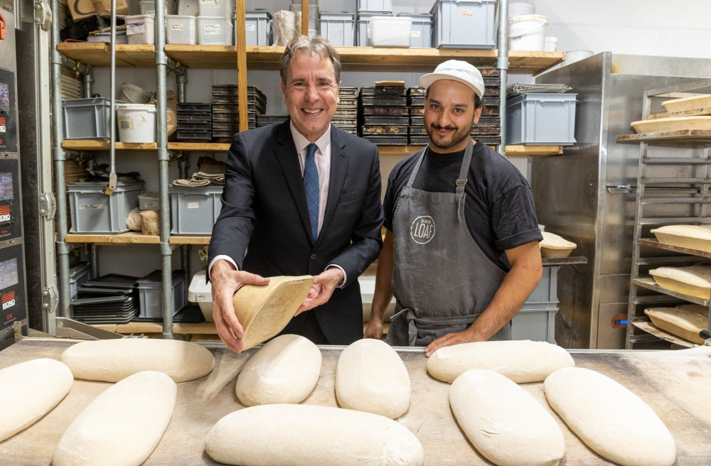 Mayor Norris baking bread with head baker Adeel Khan