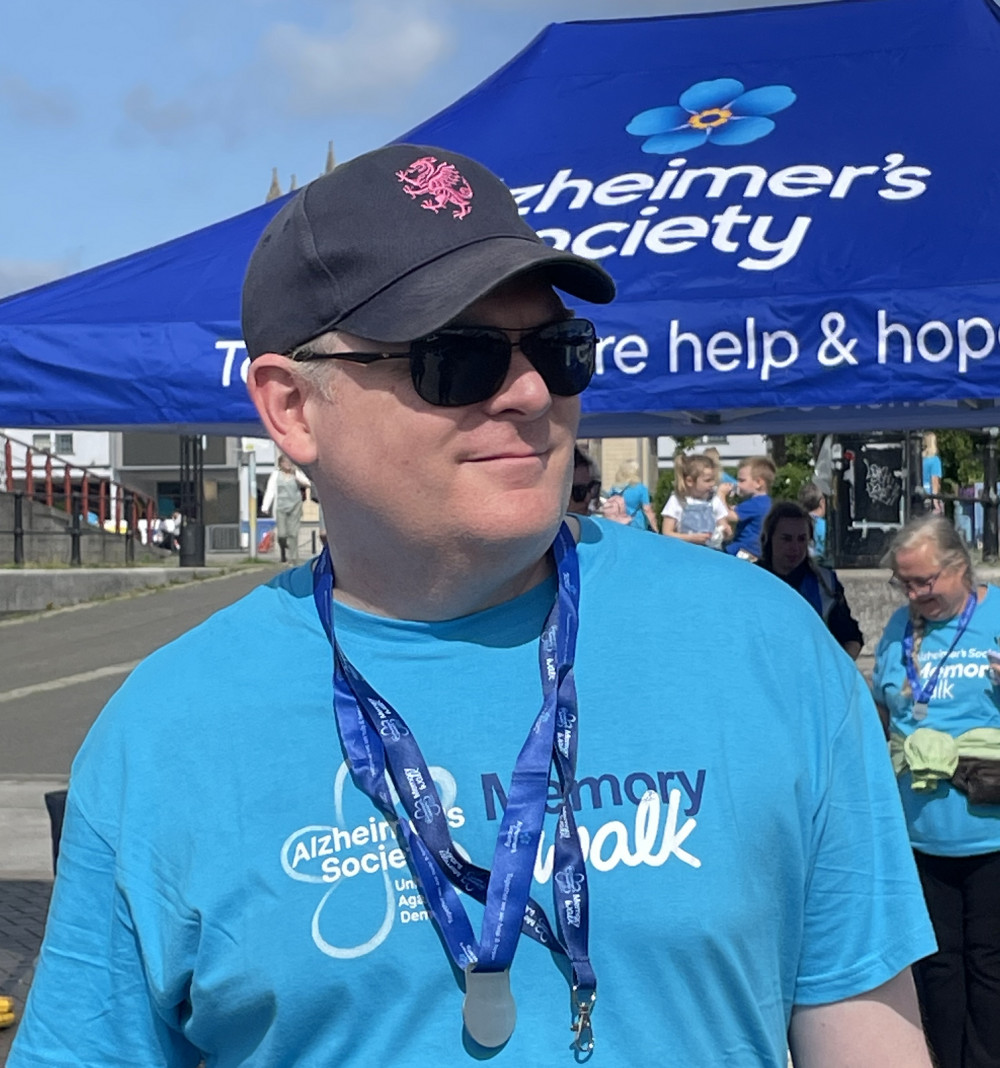 George Persson - Managing Partner of Thatcher + Hallam with his Memory Walk Medal