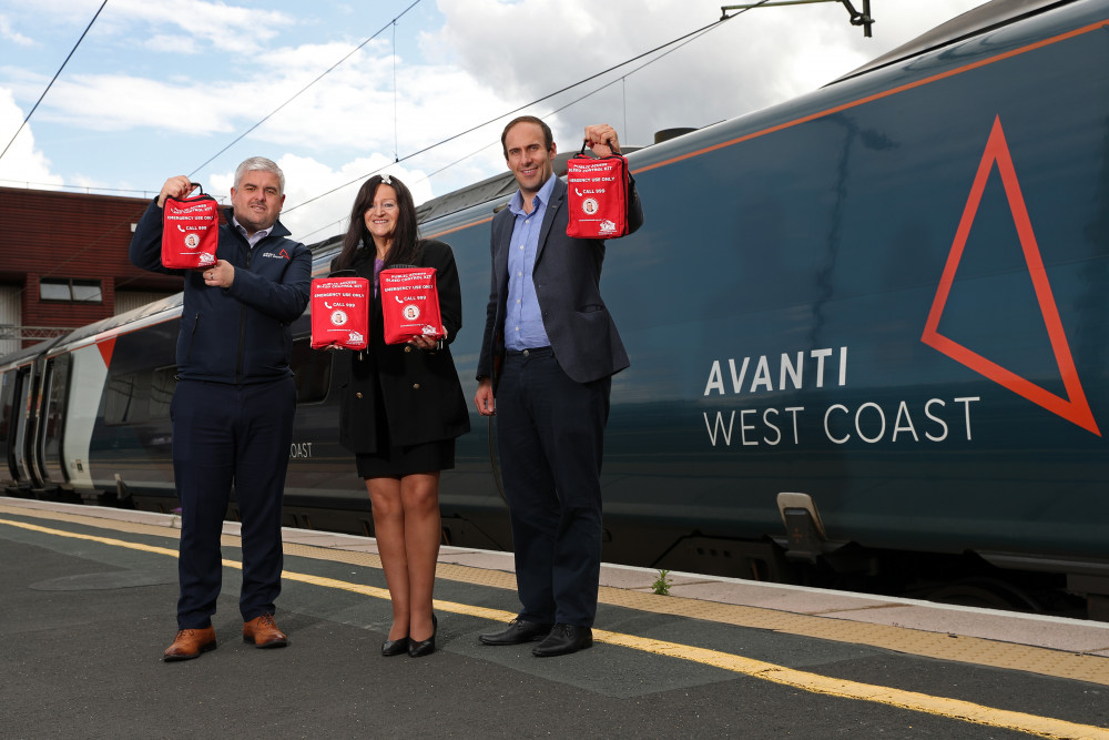 David Whitehouse, Lynne Baird MBE and Cllr Keiran Casey with the new kits, which contain vital supplies and information that could save lives. (Image - Avanti West Coast) 