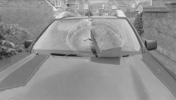 A breeze block was dropped on couple's car windscreen