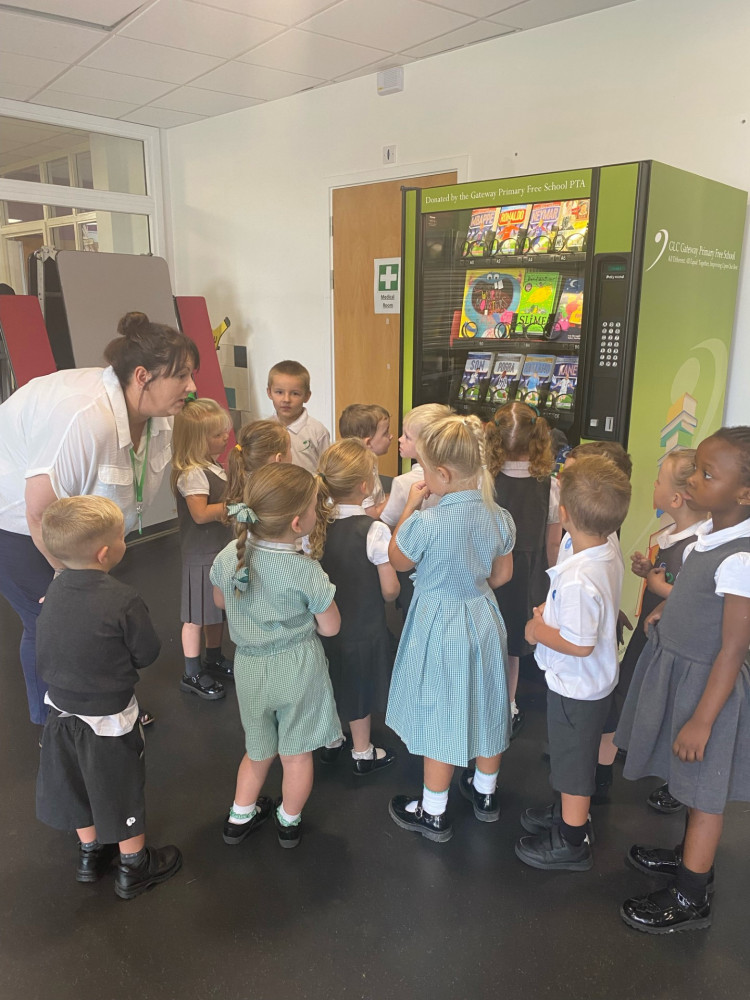 Youngsters are shown how the new machine works.