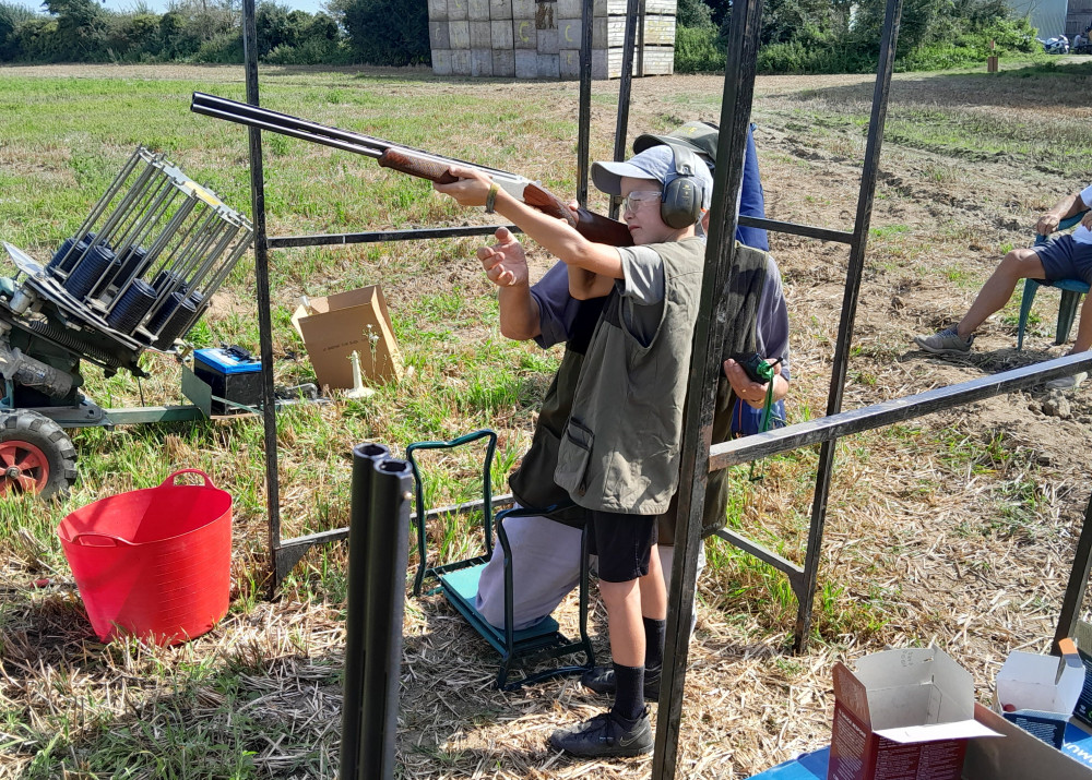 Novice Casey Adams (8) giving clay pigeon shooting a go in Chelmondiston (Picture: Nub News)