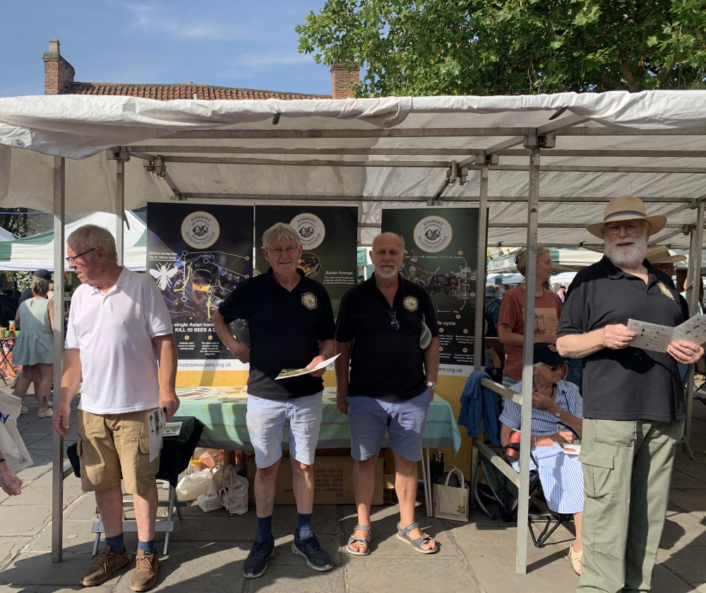 Nick Potts Chair. Central Somerset Beekeepers Association (second from right) spreading the messages in Wells 