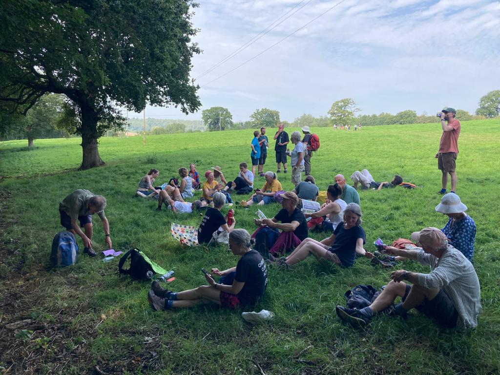 Pilgrims resting on route in shade on one of the hottest September days on record