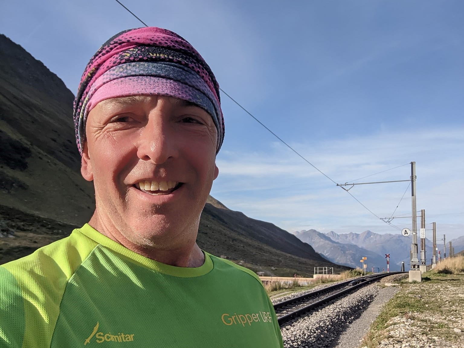 Adrian Horne wearing his MG shirt high up in the Alps