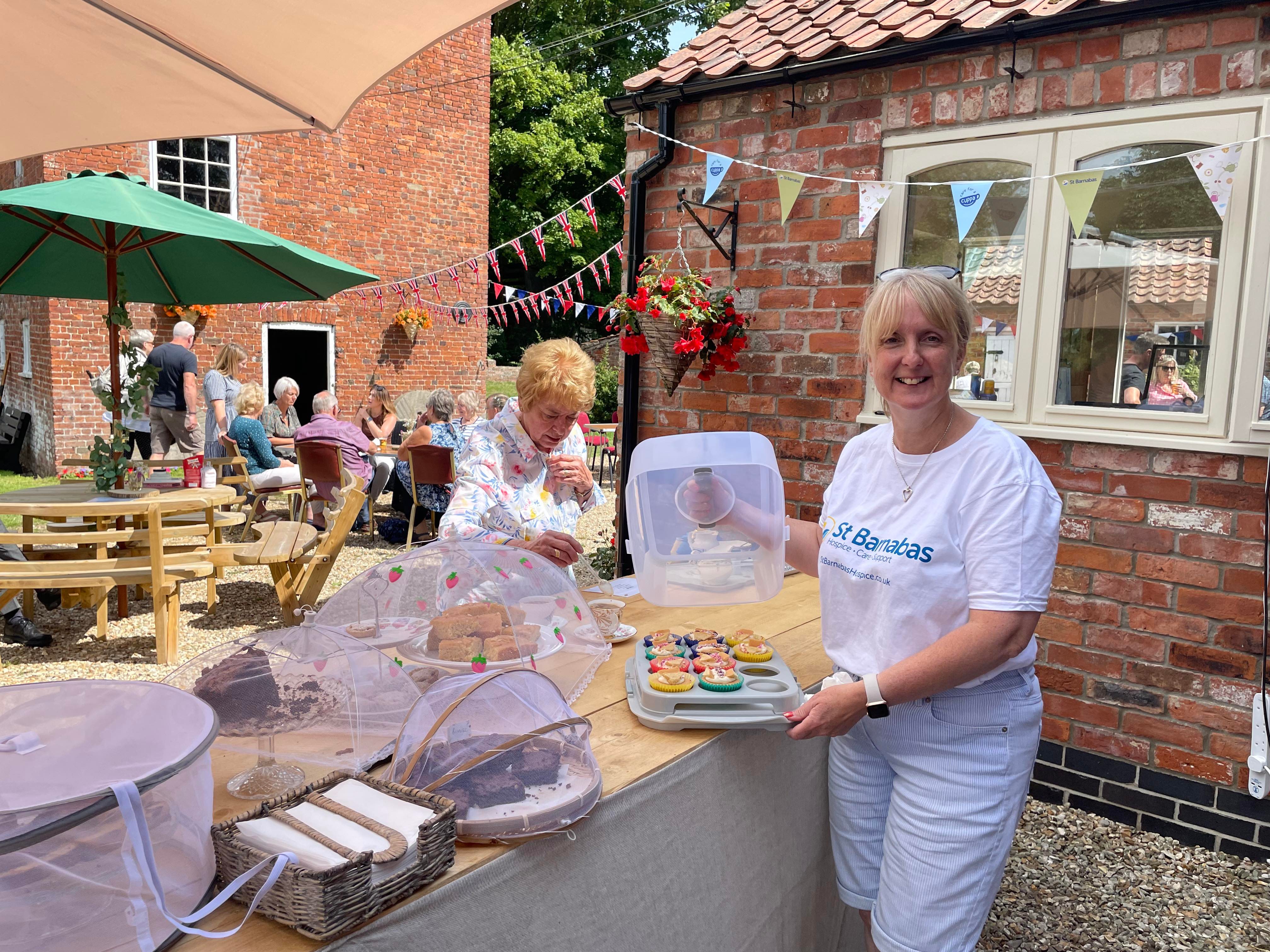 Volunteers organising a Care For A Cuppa event! Image credit: St Barnabas.