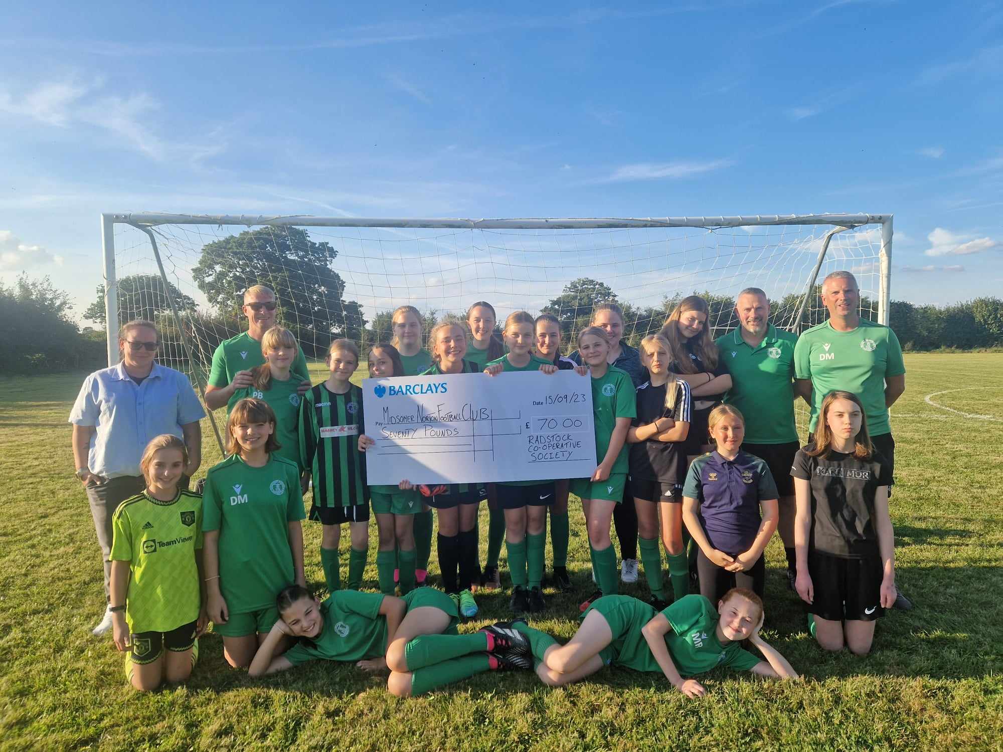 Cassie from Radstock Co-operative Society, Coaches Dan, Sam & Tim., Team Assistant Martha & the Girls Football Team Cassie from Radstock Co-operative Society, Coaches Dan, Sam & Tim., Team Assistant Martha & the Girls Football Team