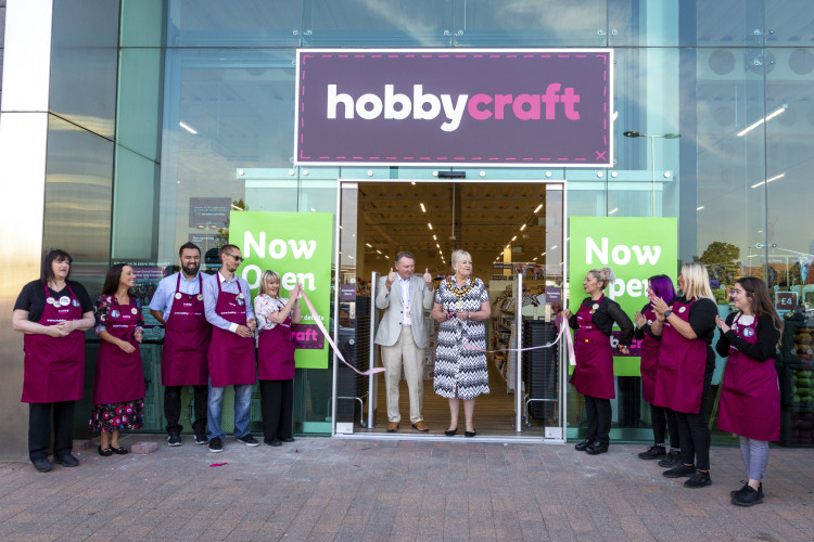 Cllr Susan Little and consort Brian open the store. 