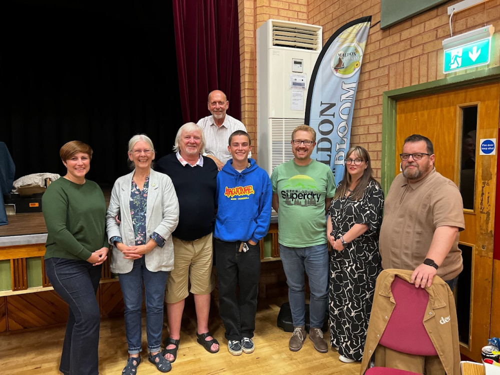 'Quiztrophenia' (pictured with Maldon In Bloom Chair Flo Shaughnessy and Quizmaster Mark Heard) won the quiz, taking home six bottles of wine. (Photo: Ben Shahrabi)