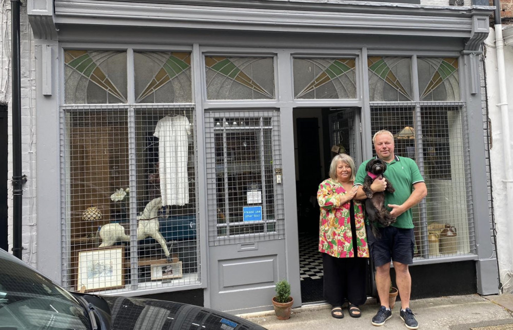 Debbie and Andrew Brown with dog Betty, outside their new shop. (Image - Macclesfield Nub News) 