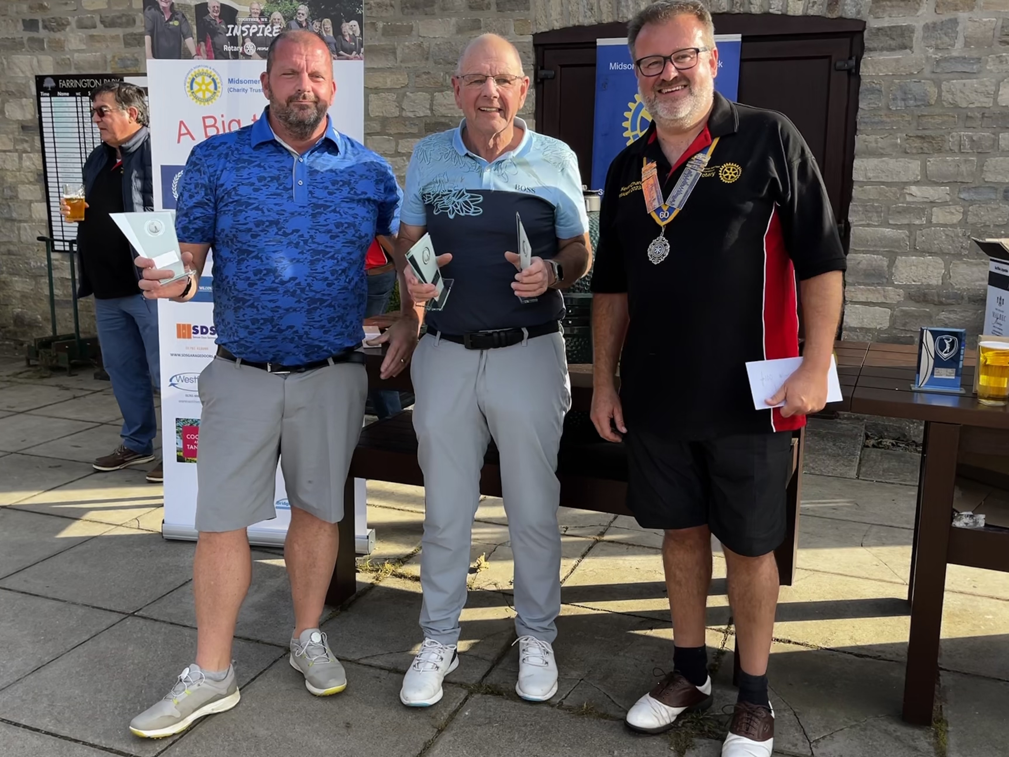 The Farrington Flyers accepted their first place trophies from Kevin Chard, Club President