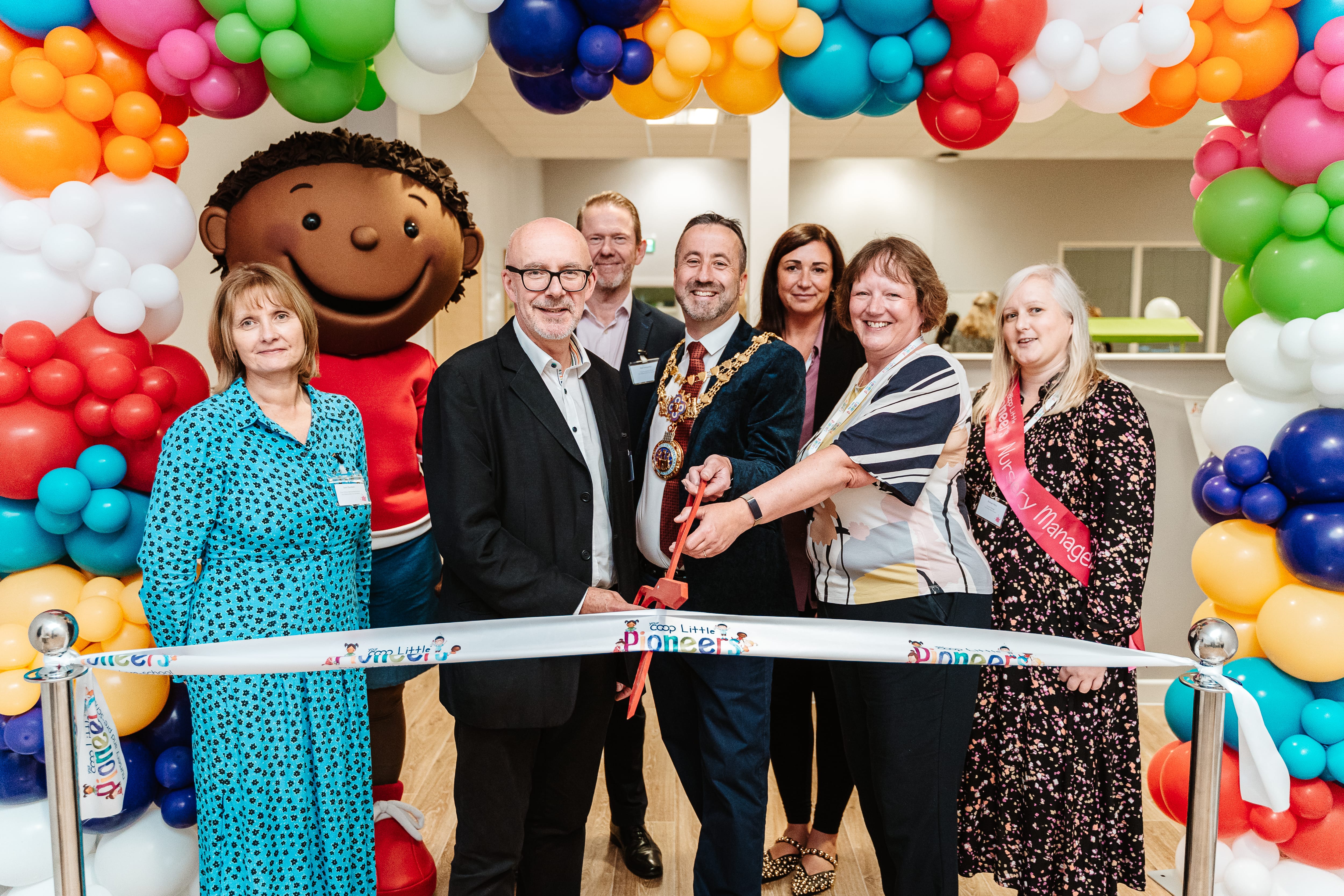 Ribbon cutting with the Mayor and the new team. Image credit: Co-op Little Pioneers.