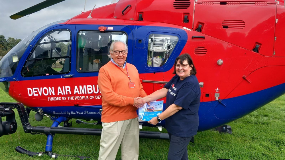 Simon Card receiving award from Helena Holt (Devon Air Ambulance Trust)