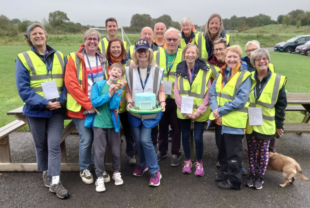 All Smiles: Volunteers with Birthday Cake