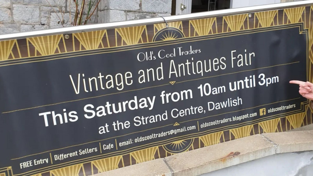 A banner for the fair outside the Strand Centre (Old's Cool Traders)