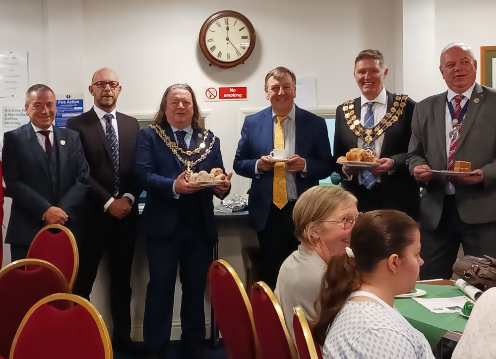 Maldon Town Councillor Nigel Miller, Centre Chairman David Hawtin, Town Mayor Cllr Andrew Lay, Maldon MP Sir John Whittingdale, District Council Chair Cllr Kevin Lagan, and Deputy Town Mayor Cllr Martin Harvey were pictured at the Masons’ Macmillan Coffee Morning. (Credit: Robert Hendrie)