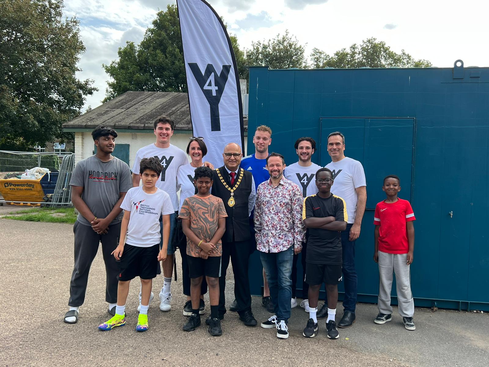 A group of local children attending the event, coaches, Sally Chacatté, founder of W4 Youth; Mayor of Ealing, Hitesh Tailor; Gary Malcolm, Councillor and W4 Youth Trustee; and Marcell Chacatté, W4 Youth Trustee (credit: Gary Malcolm(.