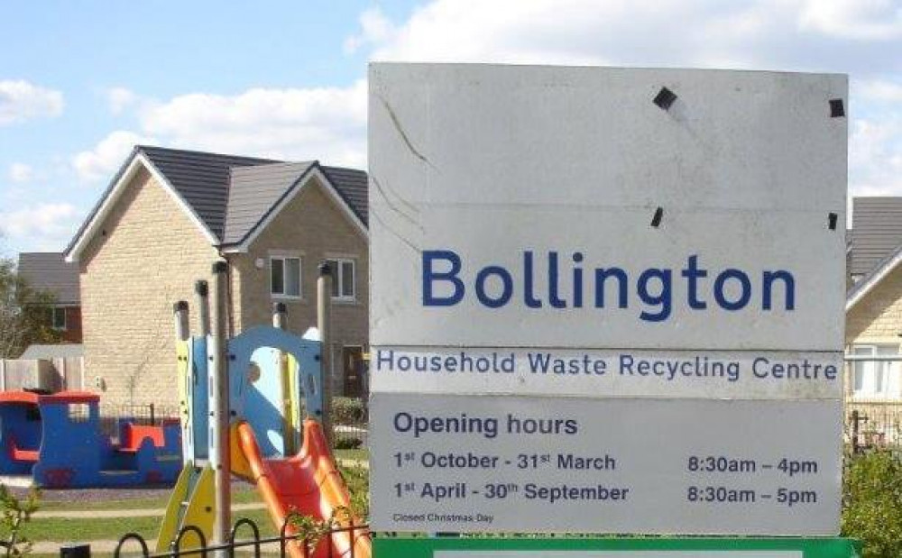 A sign for Bollington Household Waste Recycling Centre, pictured in front of the new houses there. (Image - Macclesfield Nub News) 