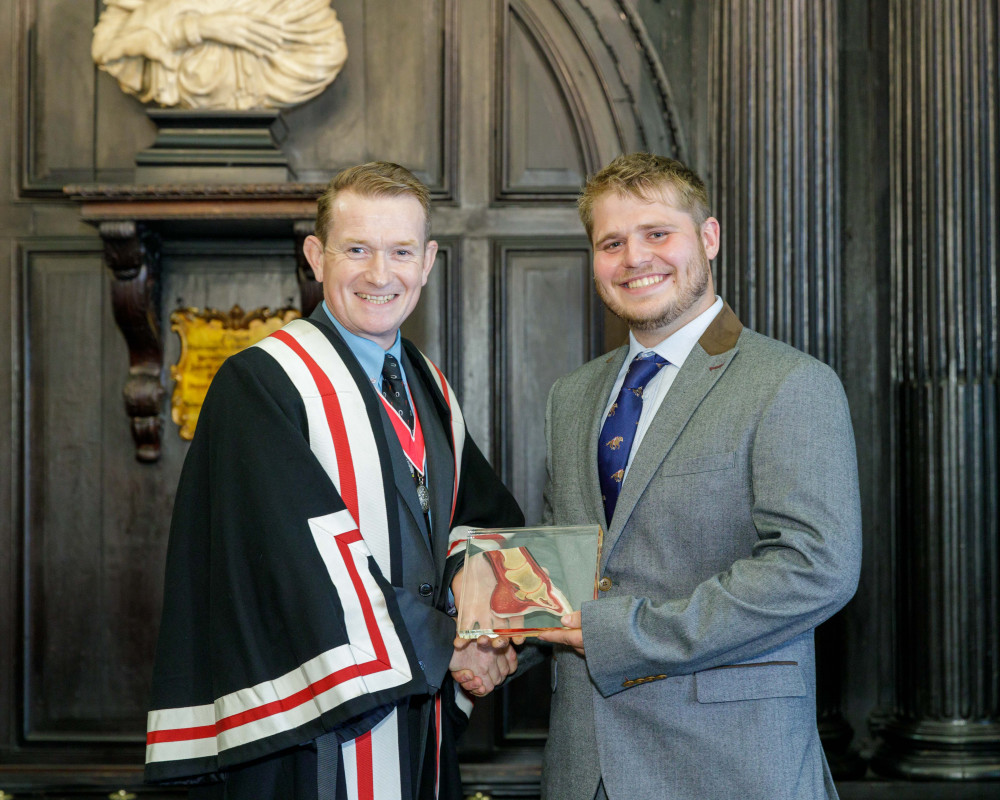 Lewis Sutor (right) receiving the David Llewellyn Prize from the Worshipful Company of Farriers. (Credit: Sharp Photography).