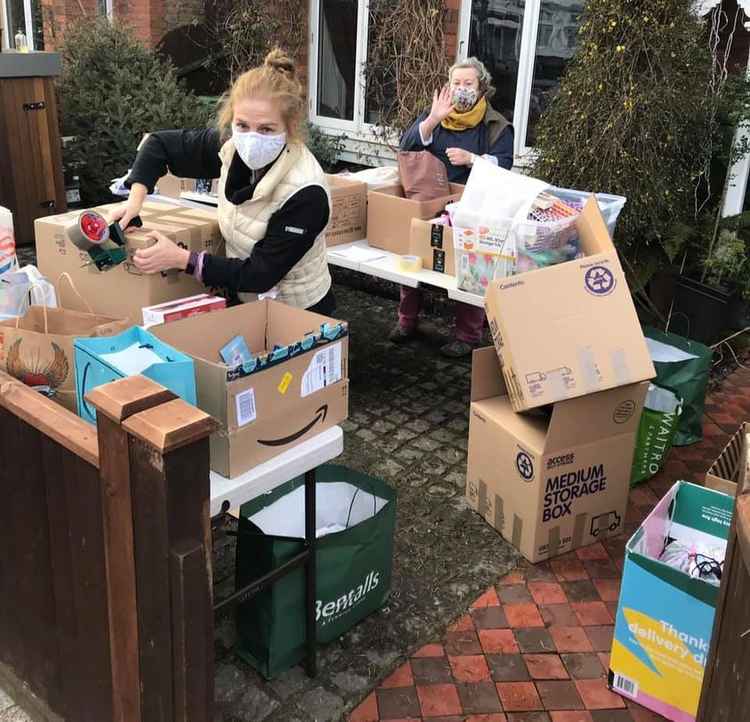 Tess and Sara packing bags