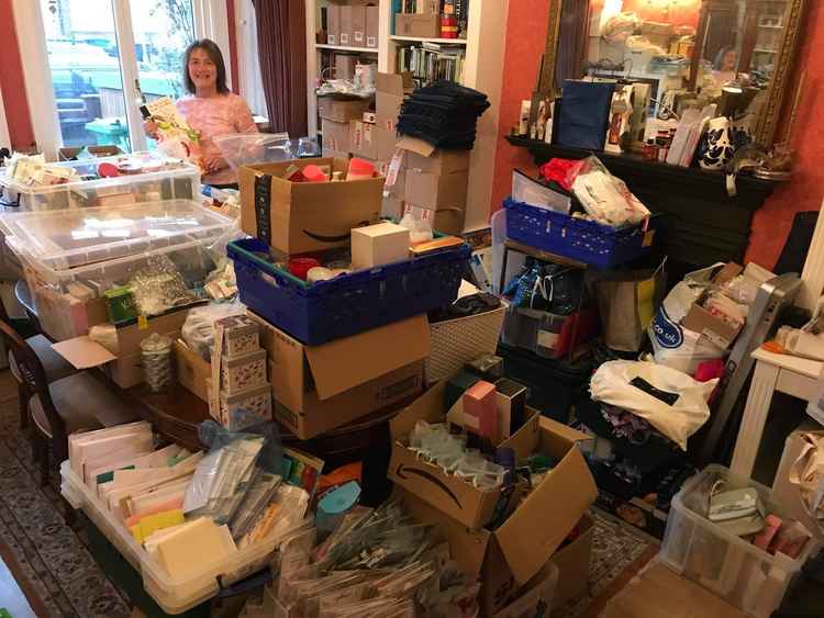 Kate sorting donations in her front room