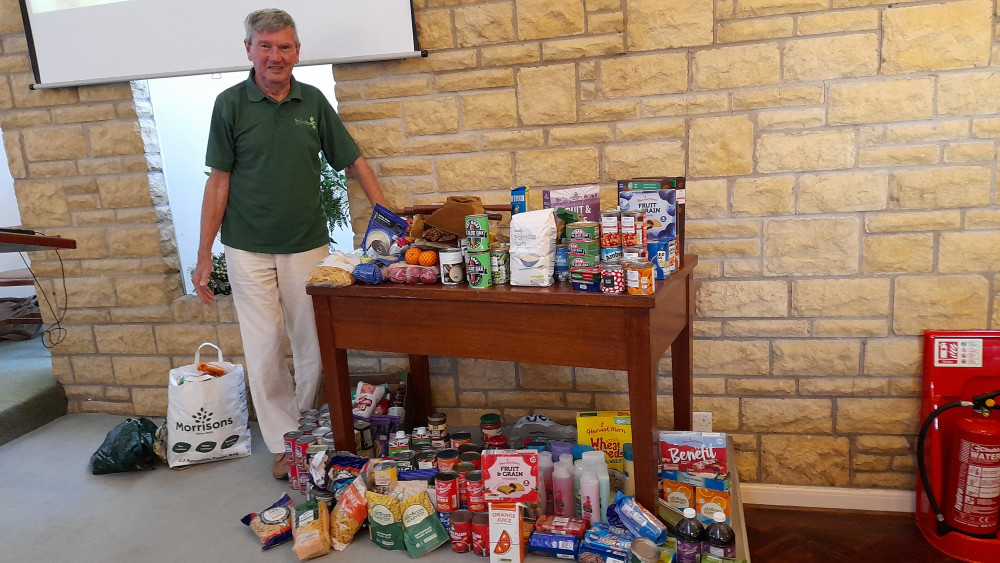 Mike Grove from Foodbank gratefully received the food donations