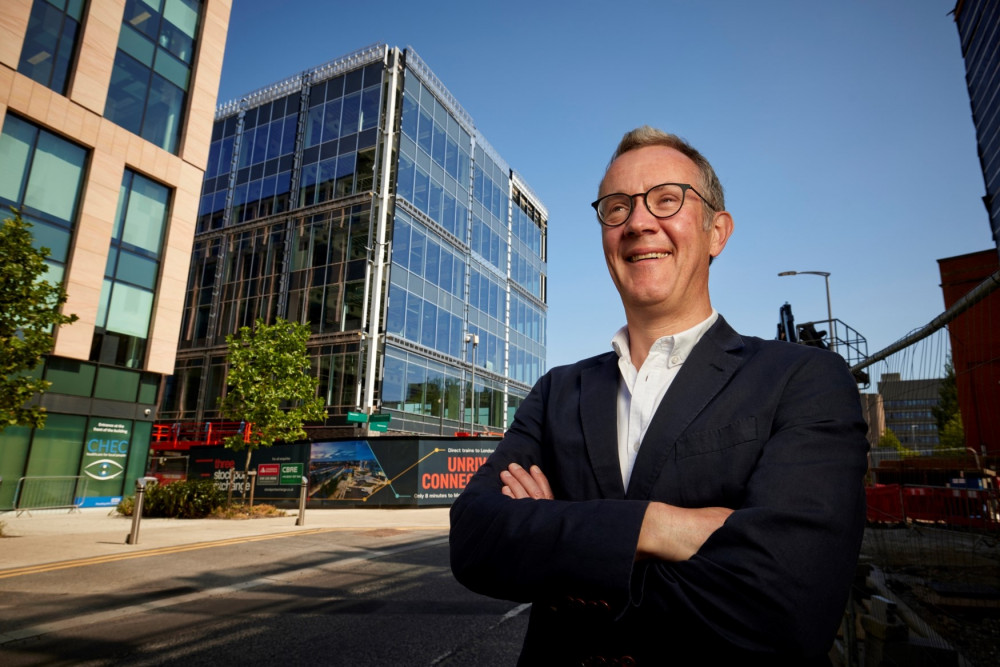 HURST managing partner Tim Potter outside the firm's new HQ at 3 Stockport Exchange (Image - HURST)