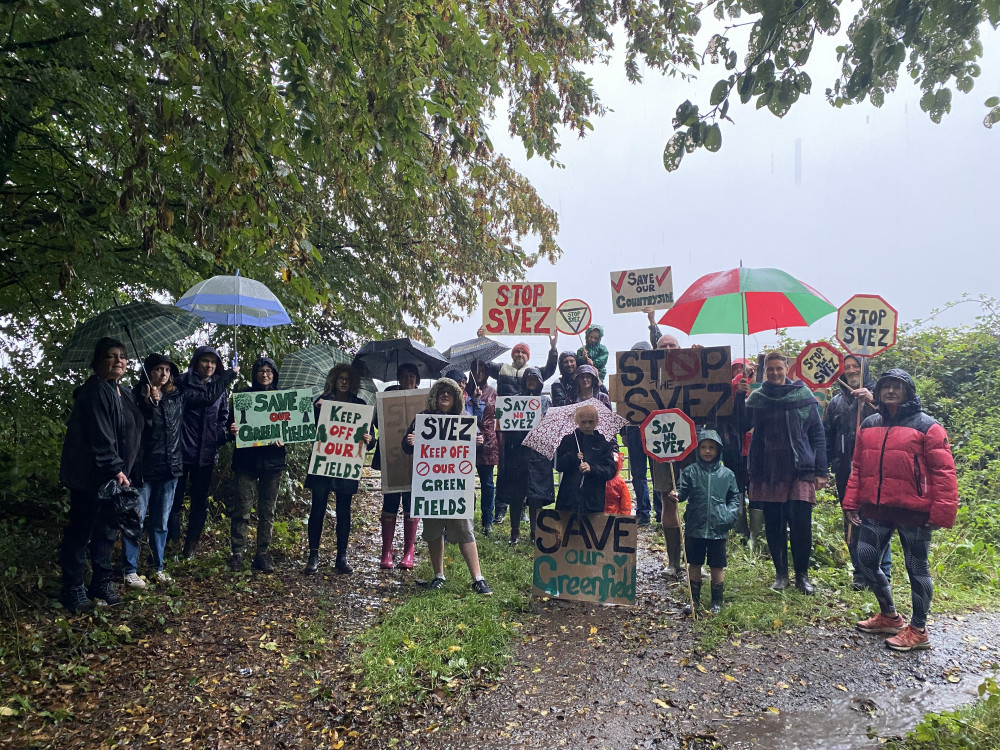 Midsomer Norton Locals braved the rain to protest plans to develop green fields next to Old Mills Batch; Photo John Wimperis Local Democracy Reporter