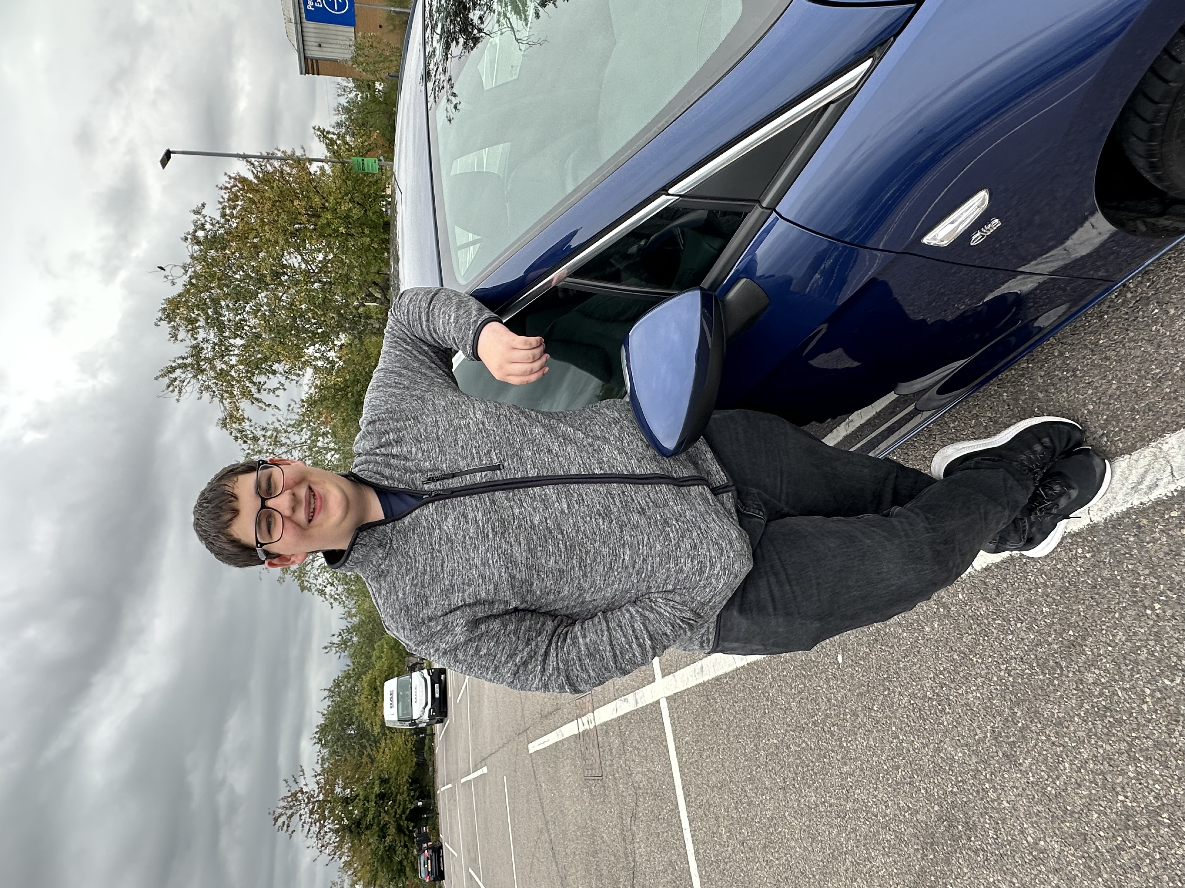 Jamie Rodwell alongside his car