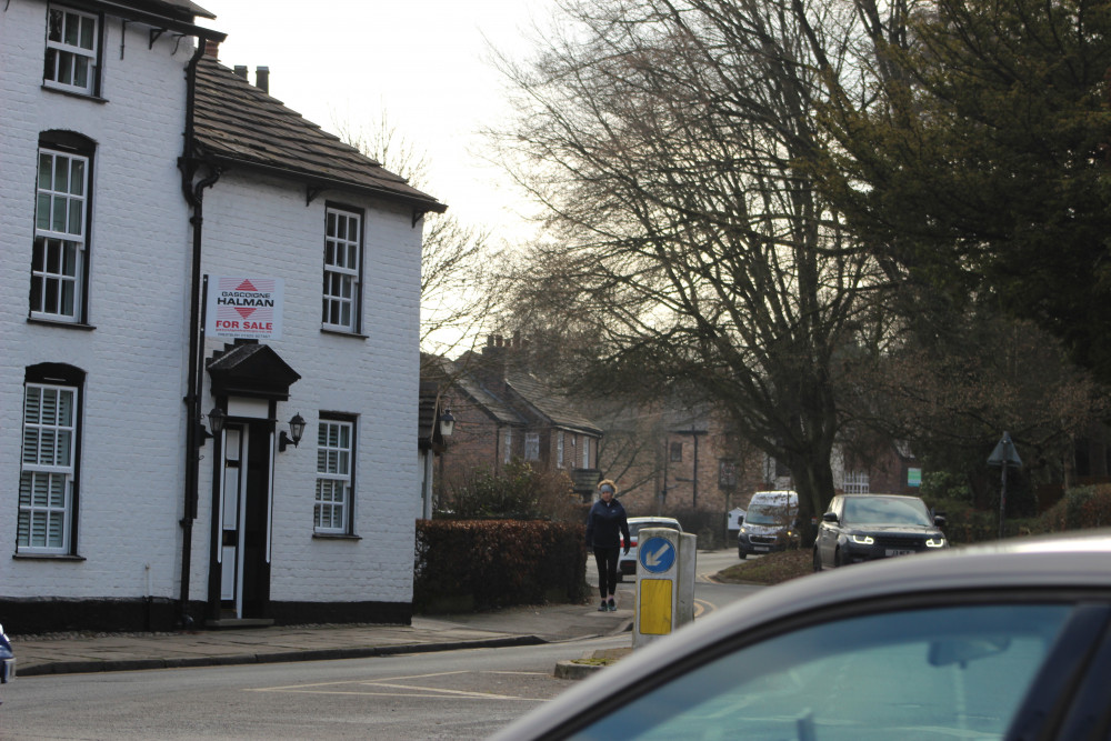 Macclesfield: Cars drive along The Village, Prestbury. (Image - Macclesfield Nub News) 