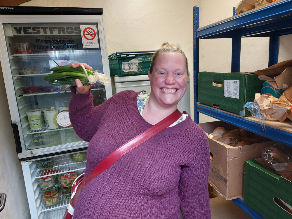 Terri Pitts knows her onions ! At the community fridge currently behind Frome Town Hall. Photo Frome Nub News 