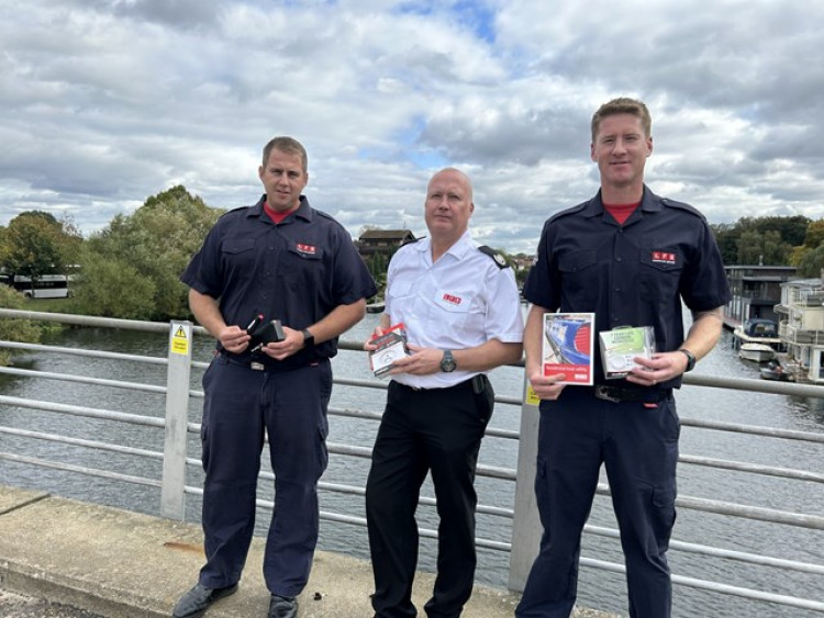 Firefighter Matt Clark, left, Richmond Borough Commander Rob Davies, and Firefighter Rhodri Davies on a bridge leading onto Tagg's Island. (Photo: London Fire Brigade)