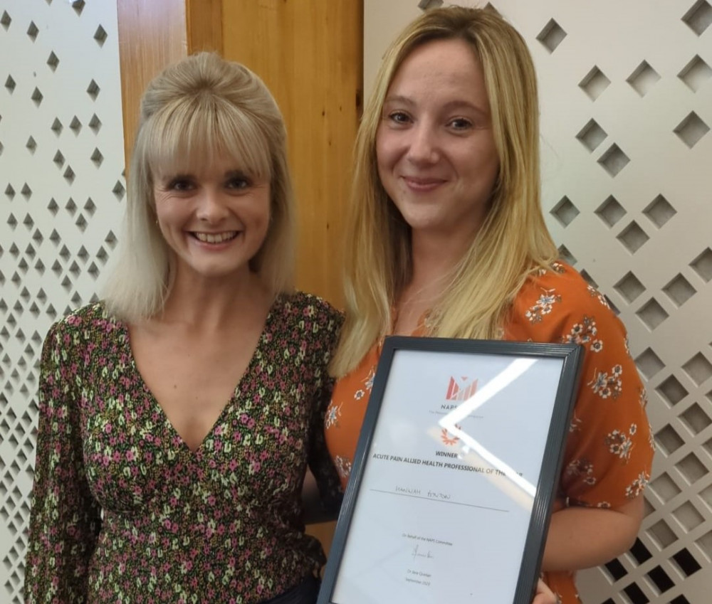 Hannah Fenton (right) with her award, and colleague Harriet Forbes (left) (Image - Stockport NHSFT)